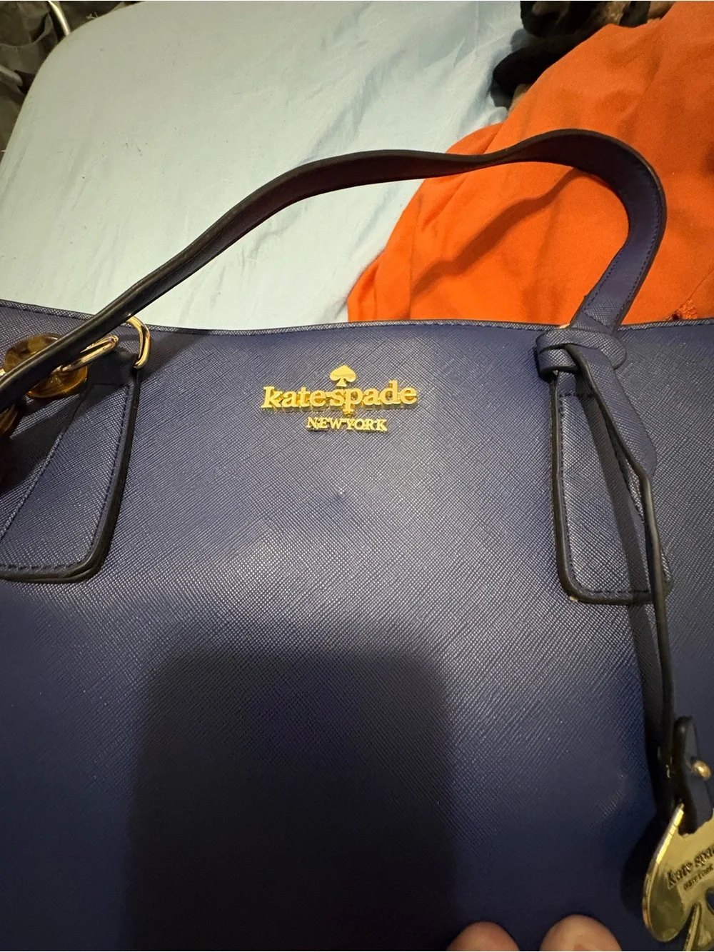 Structured Navy Fashion Tote with Gold Chain Accent and Wallet.